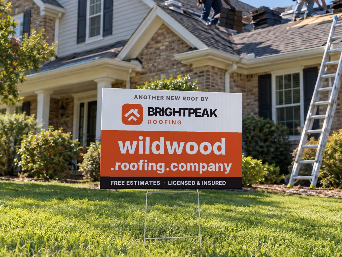 wildwood.roofing.company on a yard sign in front of a house getting a new roof